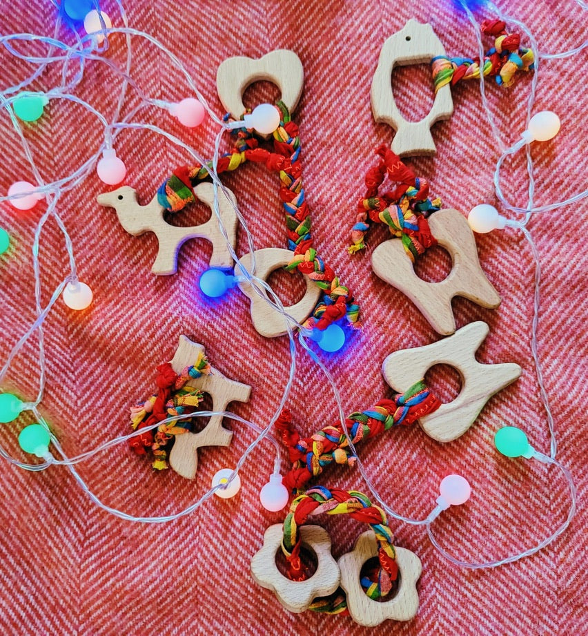 teething toy with plaited fabric fiddley bits
