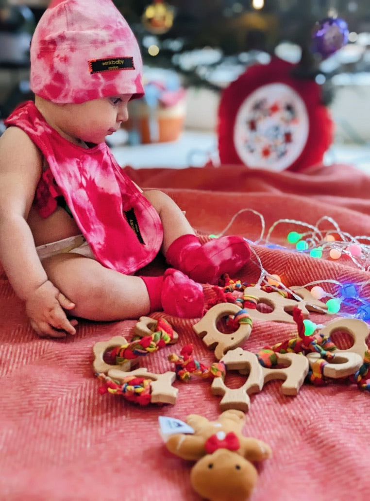 teething toy with plaited fabric fiddley bits