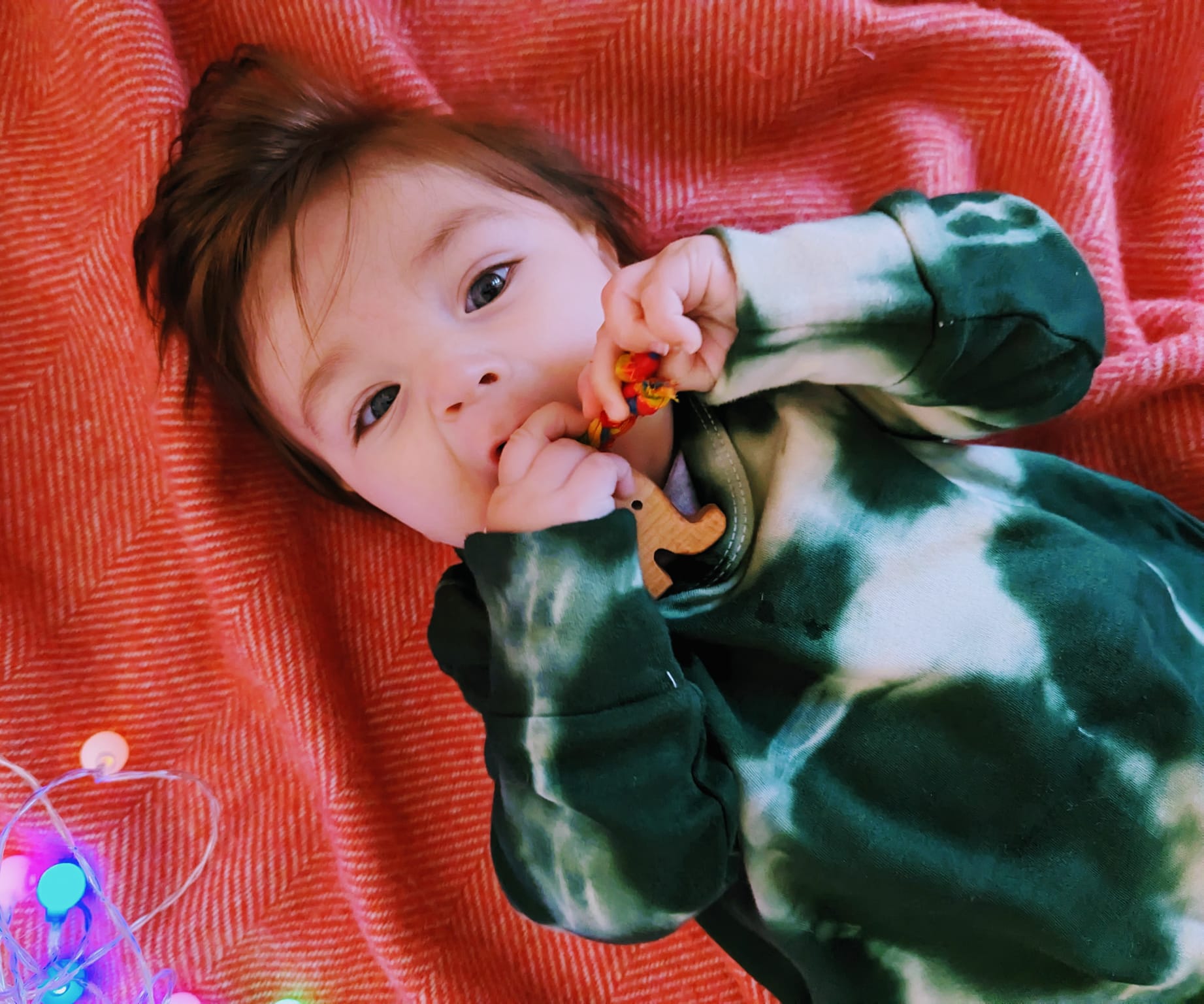 teething toy with plaited fabric fiddley bits