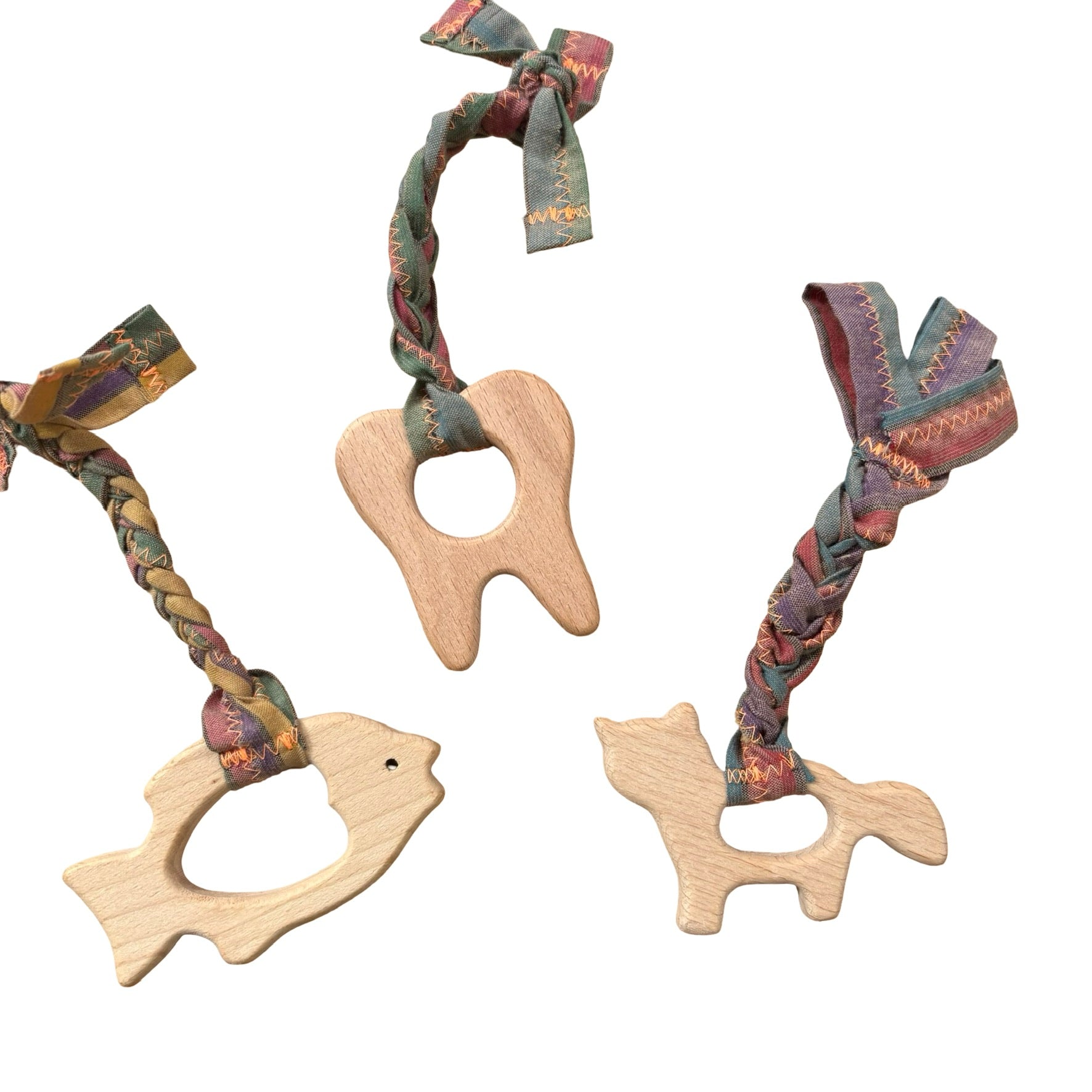 teething toy with plaited fabric fiddley bits